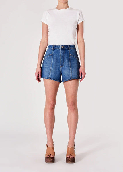 Person wearing blue denim shorts and a white t-shirt on a white background