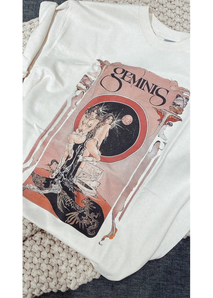 White t-shirt with 'Gemini' zodiac design on a textured surface
