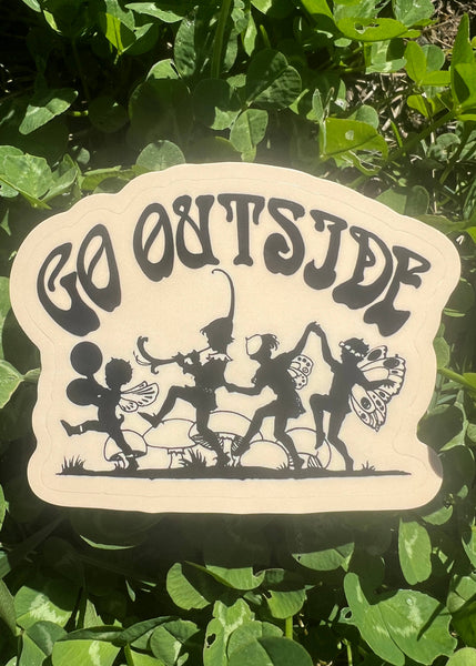 Decorative sign with silhouettes of children and text 'GO OUTSIDE' on a green leafy background