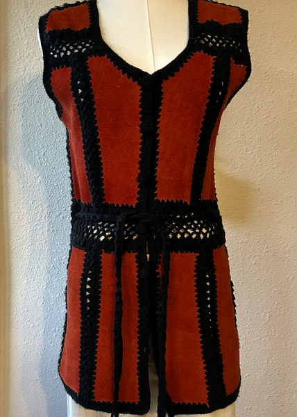 Red and black striped dress on a mannequin against a plain background