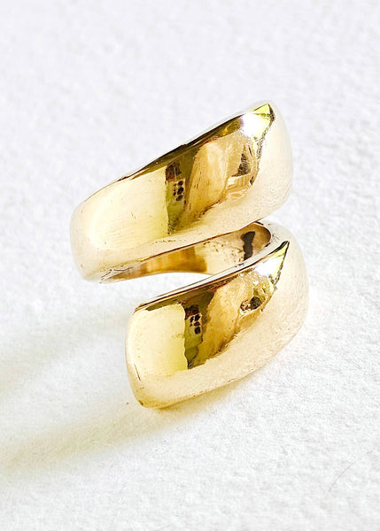 Gold spiral ring on a white background